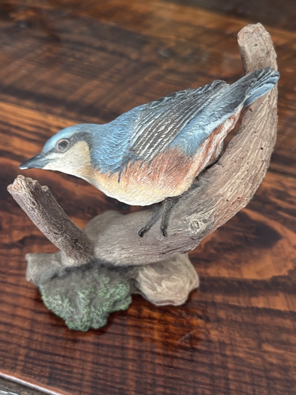 Red-breasted nuthatch on branch decorative figurine